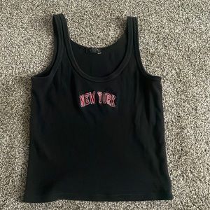 Brandy black New York tank top, worn lightly